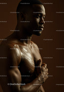 Muscular Male Model with Body Paint and Artistic Makeup in Studio