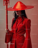 Elegant Woman in Red Dress with Accessories Against Red Background