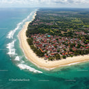 Tropical Coastal Town with Sandy Beach and Ocean Waves