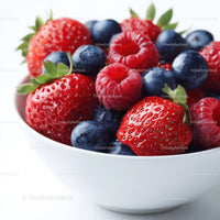 Fresh Mixed Berries in a White Bowl with Green Leaves