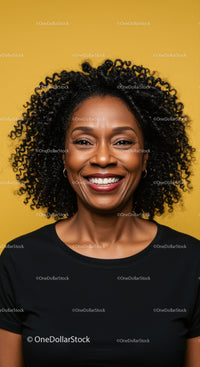 Young Black Woman with Curly Hair Smiling Against Bright Yellow Background