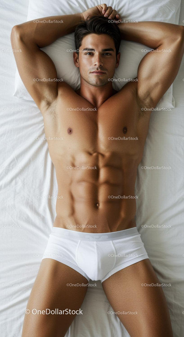 Fit young man relaxing on bed wearing white underwear