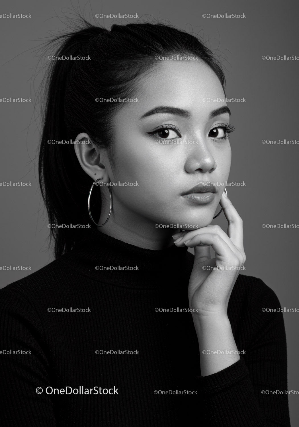 Stylish Black and White Portrait of Young Woman with Hoop Earrings