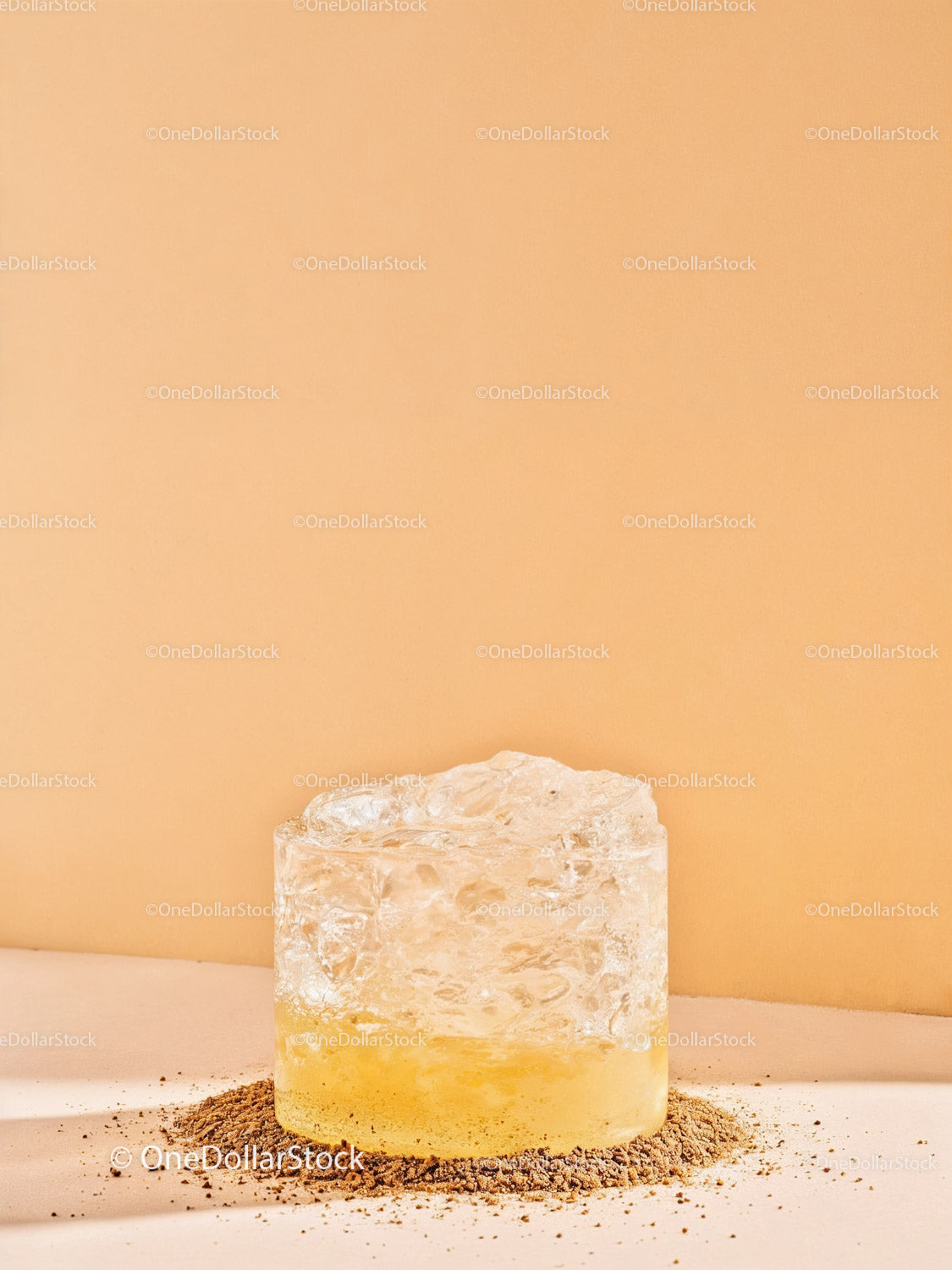 Clear Ice Cube on Ground with Orange Light Glow