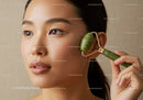 Close-Up of Woman Using Jade Roller for Skincare Facial Reflection