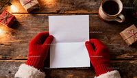 Hands in red gloves holding blank paper on rustic table JPG Mockup Image preview