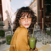 Stylish Young Woman Wearing Yellow Sunglasses in Urban Street Scene