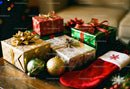 Colorful holiday gifts and decorations on wooden table