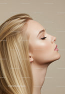 Calm blonde woman with flawless profile and soft makeup