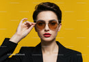Fashionable Woman Wearing Sunglasses Against Bright Yellow Background