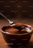 Rich chocolate mousse with cocoa dust in a bowl