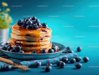 Stack of Fluffy Pancakes with Blueberries and Syrup on Blue Background