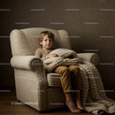 Child sitting comfortably with cozy knitted blanket