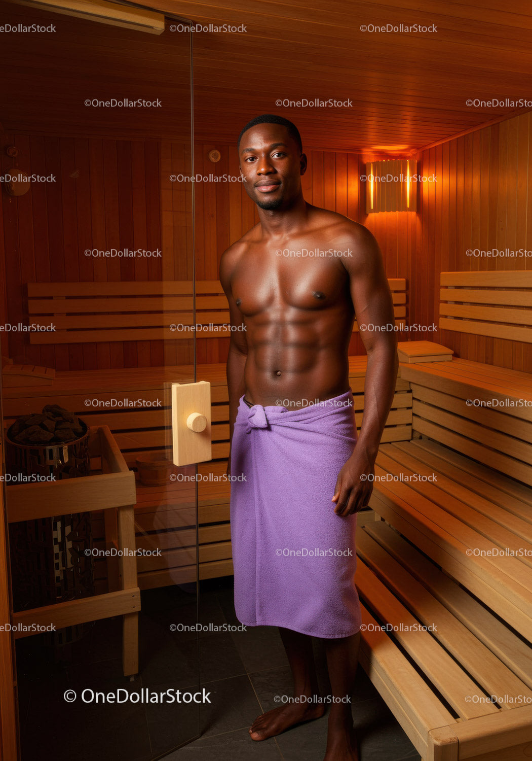Young Man Relaxing in Sauna with Towel in Wooden Interior