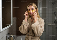 Woman Applying Gold Eye Patches for Skincare Routine
