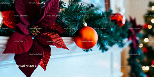 Festive Christmas Garland with Red Ornament on Mantel