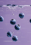 Fresh blueberries submerged in clear water bubbles