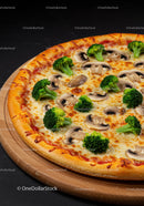 Fresh broccoli and mushroom pizza on wooden board
