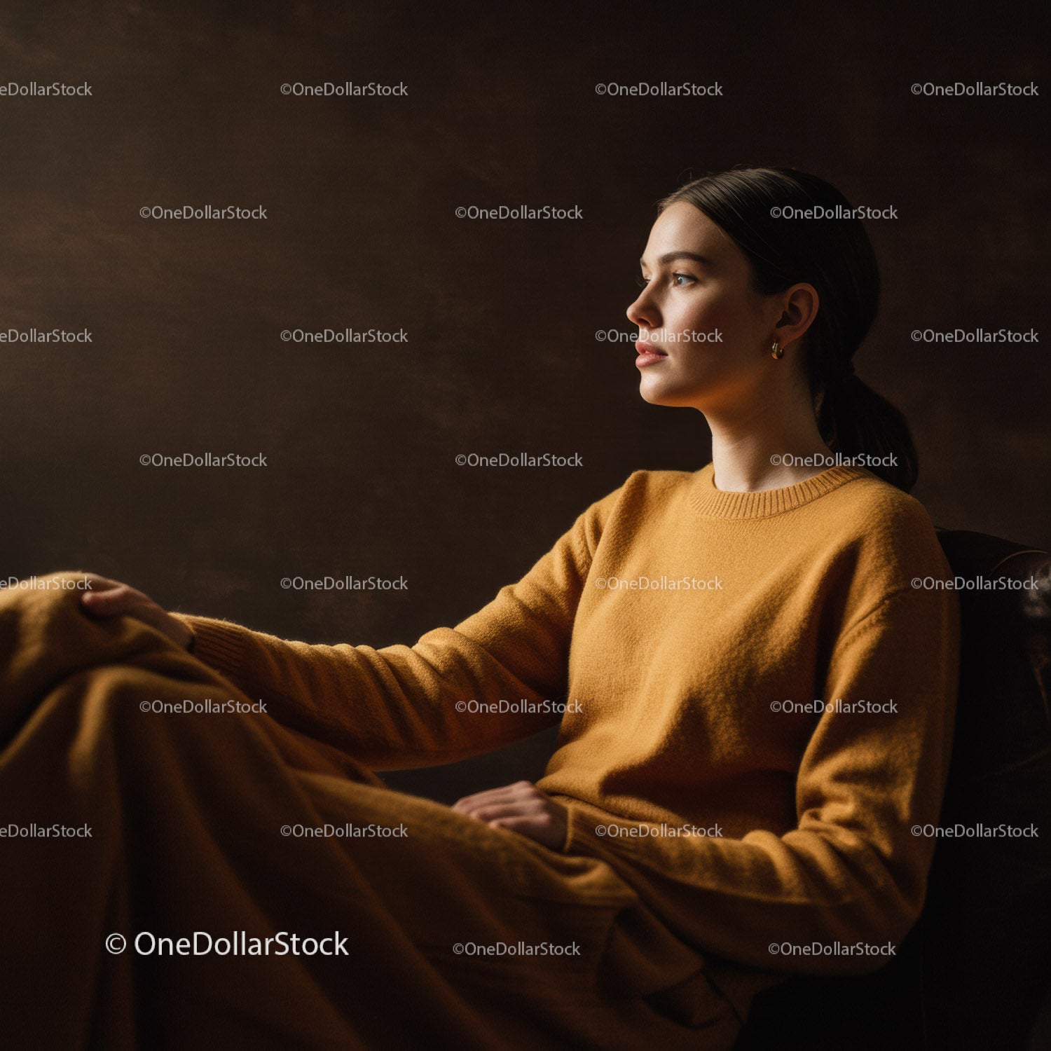 Elegant Woman in Mustard Sweater Sitting in Cozy Indoor Environment