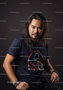 Confident man with long hair posing against dark background