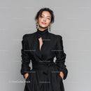 Elegant Woman in Black Dress Posing Confidently for Fashion Photography