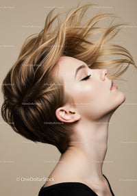 Serene woman with flowing hair against neutral background