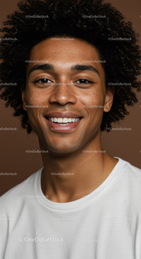 Close-Up Portrait of Smiling Man with Curly Hair and Bright Smile