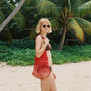 Woman in Bikini and Red Mesh Bag at Tropical Beach