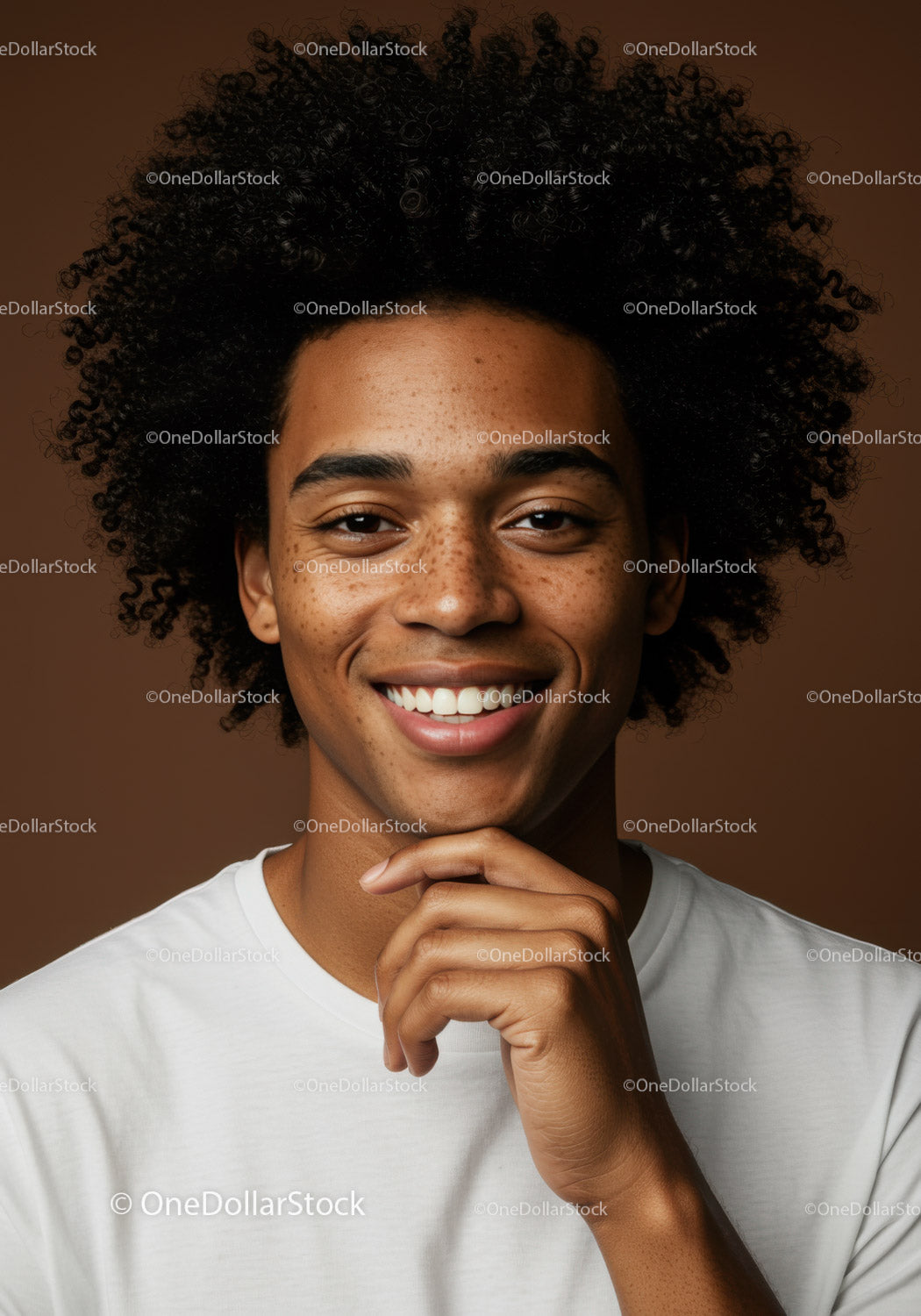 Portrait of Young Smiling Woman with Curly Hair and Freckles