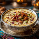 Rich Saffron Milk Dessert Garnished with Nuts and Rose Petals