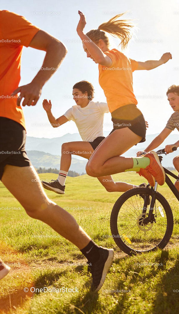 Active young people jumping and biking outdoors