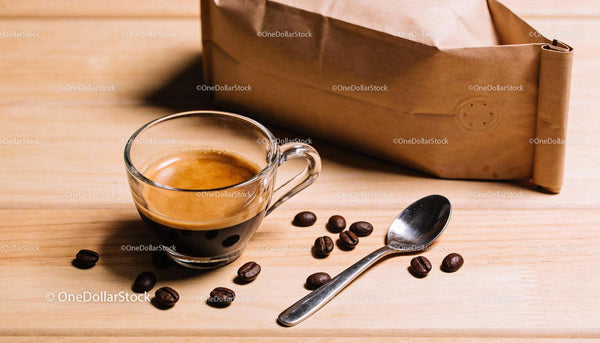 Fresh espresso with coffee beans and kraft bag