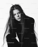 Expressive Black and White Portrait of Young Woman with Long Hair