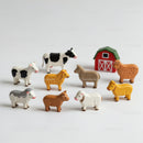 Colorful Wooden Farm Animal Figures with Red Barn and Green Roof