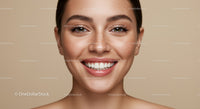 Close up of smiling woman with natural freckles and clear skin