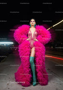 Fashion Model in Vibrant Pink and Yellow Flowing Gown