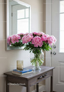 Pink Peony Bouquet in Glass Vase on Wooden Table in Interior
