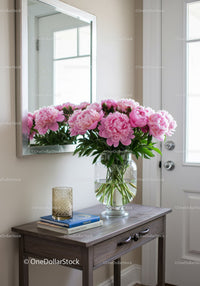 Pink Peony Bouquet in Glass Vase on Wooden Table in Interior