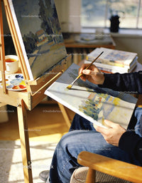 Person Painting Landscape Scenes in Cozy Art Studio