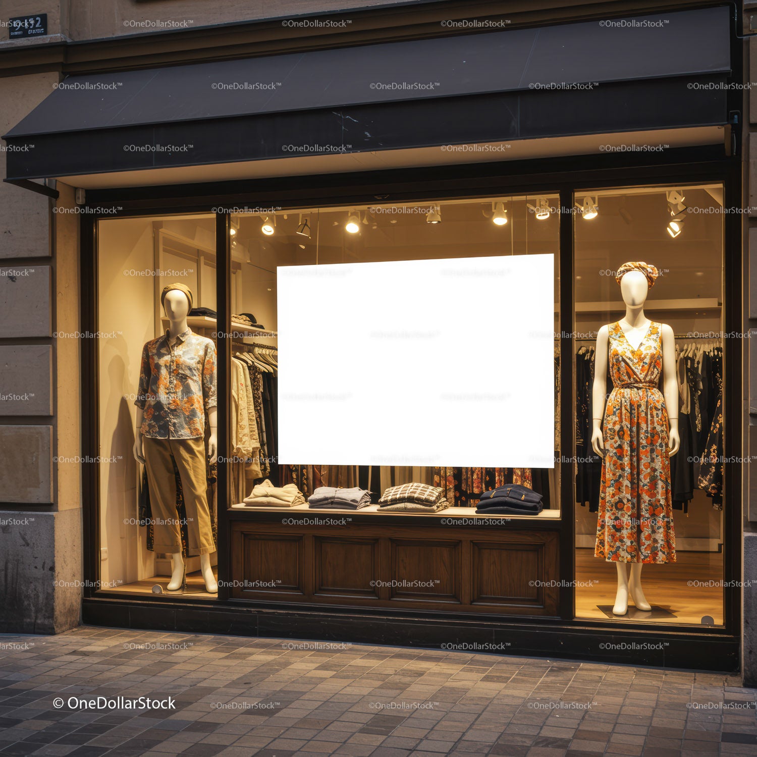 Fashion boutique window with mannequins dressed in autumn styles