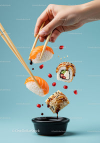 Fresh sushi pieces dipped in soy sauce with chopsticks
