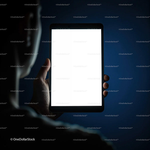 Person Holding Illuminated Digital Tablet in Dark Room JPG Mockup Image