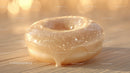 Close-up of a Conch Shell on Sand with Warm Sunlight
