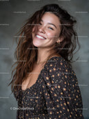 Joyful Woman with Curly Hair Wearing Floral Dress in Studio