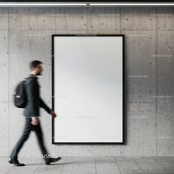Businessman walking past blank framed poster on concrete wall JPG Mockup Image