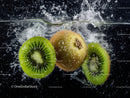 Fresh Kiwi Fruit Slices Splashing into Water in Vibrant Splash Photography