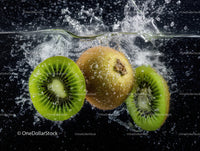 Fresh Kiwi Fruit Slices Splashing into Water in Vibrant Splash Photography
