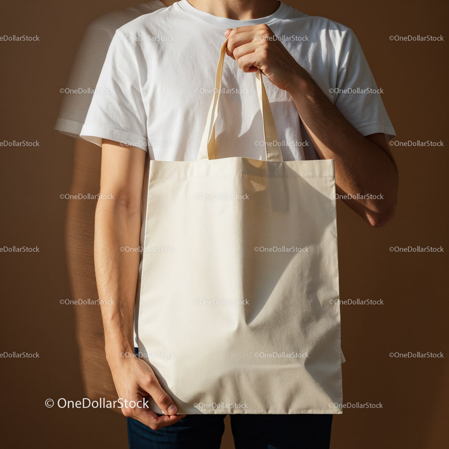 Man holding blank eco friendly canvas tote bag