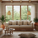 Cozy beige sofa by large window with natural light