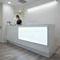 Modern medical reception area with nurse at counter